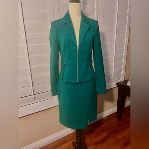 White/Black suit.  Size 4.  Rich green with gold detail.